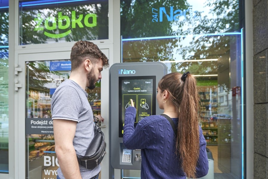 a person standing in front of a store window