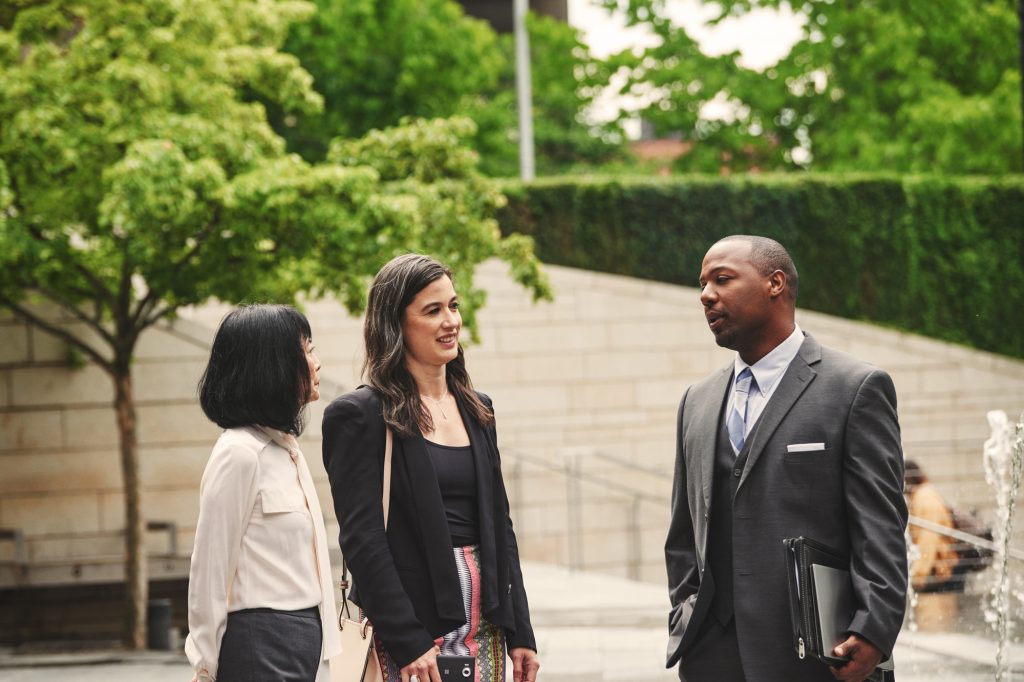 Government officials talking outside