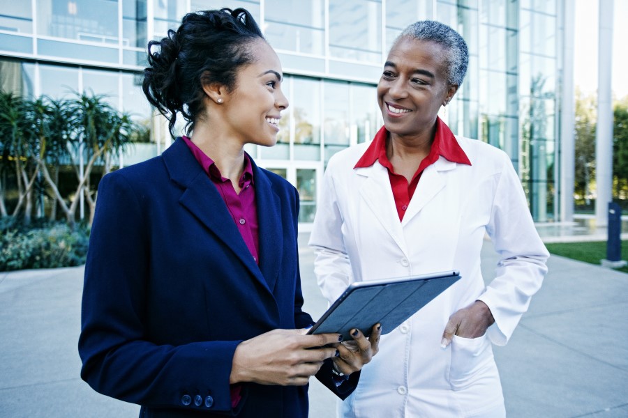 Two female healthcare professionals talking