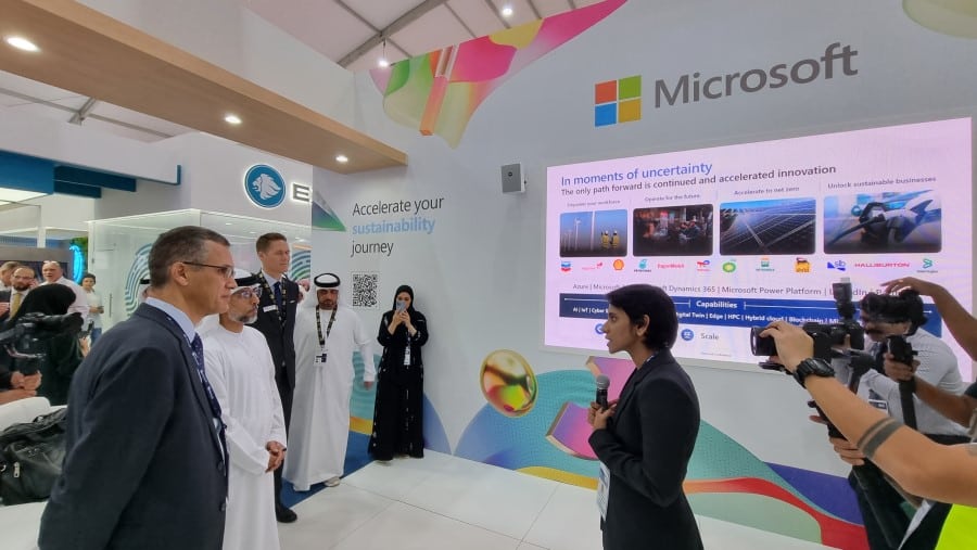 Hema Prapoo speaking with His Excellency Suhail Al Mazrouei, Minister of Energy in the United Arab Emirates, at the Microsoft booth at ADIPEC 2023.