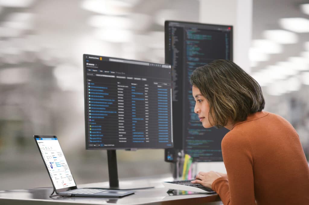 a person standing in front of a computer