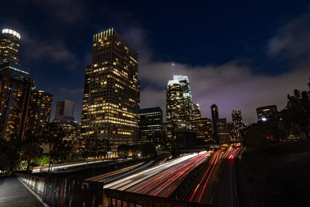 Time-lapse of nighttime traffic around a city core.